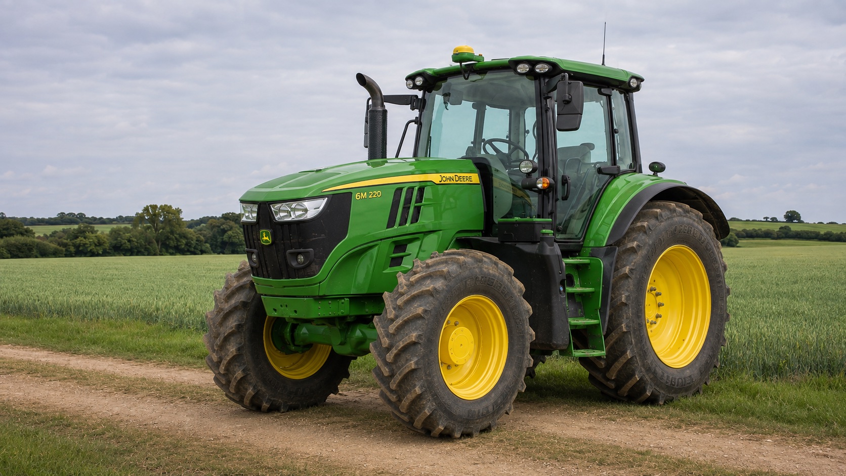 Tracteur John Deere 6M 220 présenté dans un environnement agricole