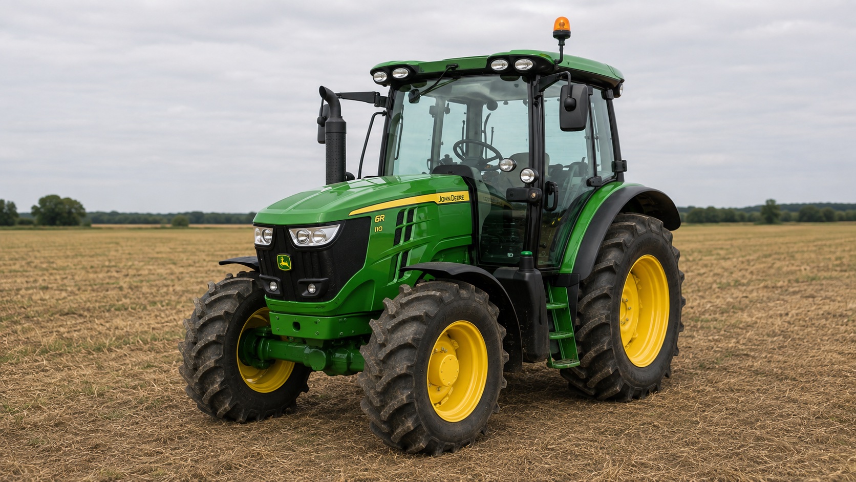 Tracteur John Deere 6R 110 présenté dans un environnement agricole