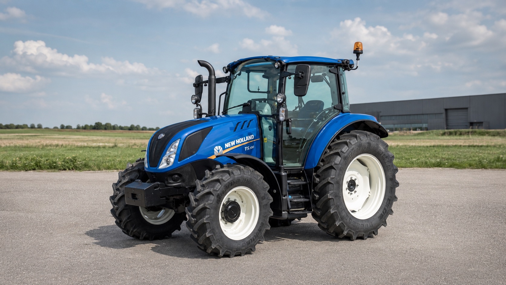 Tracteur New Holland T5.100 présenté dans un environnement agricole