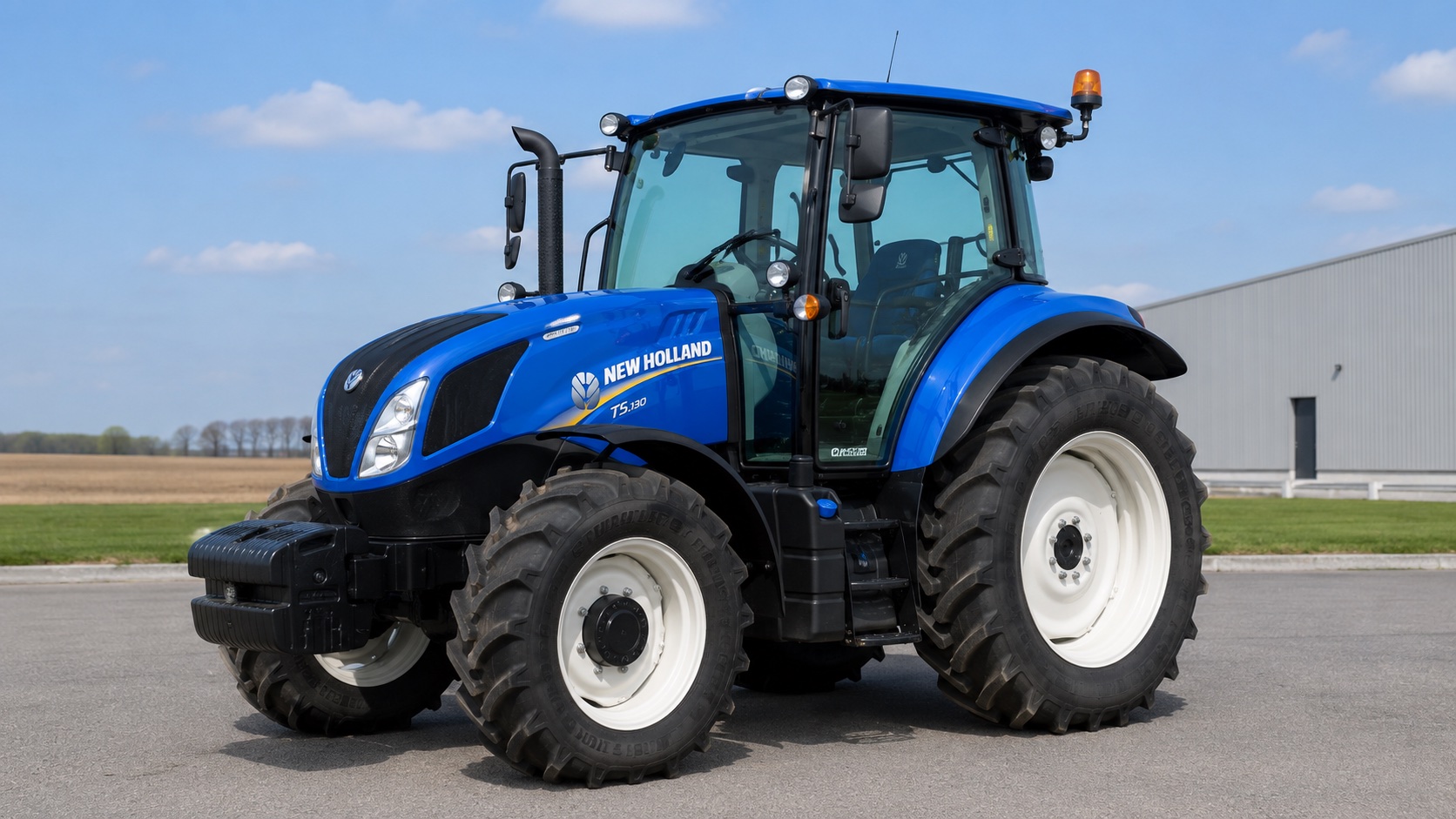 Tracteur New Holland T5.130 présenté dans un environnement agricole